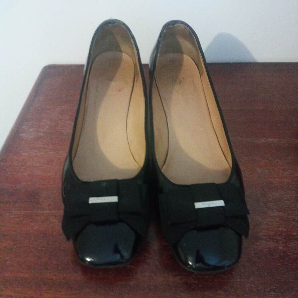 Salvatore Ferragamo patent leather pumps with a grosgrain bow